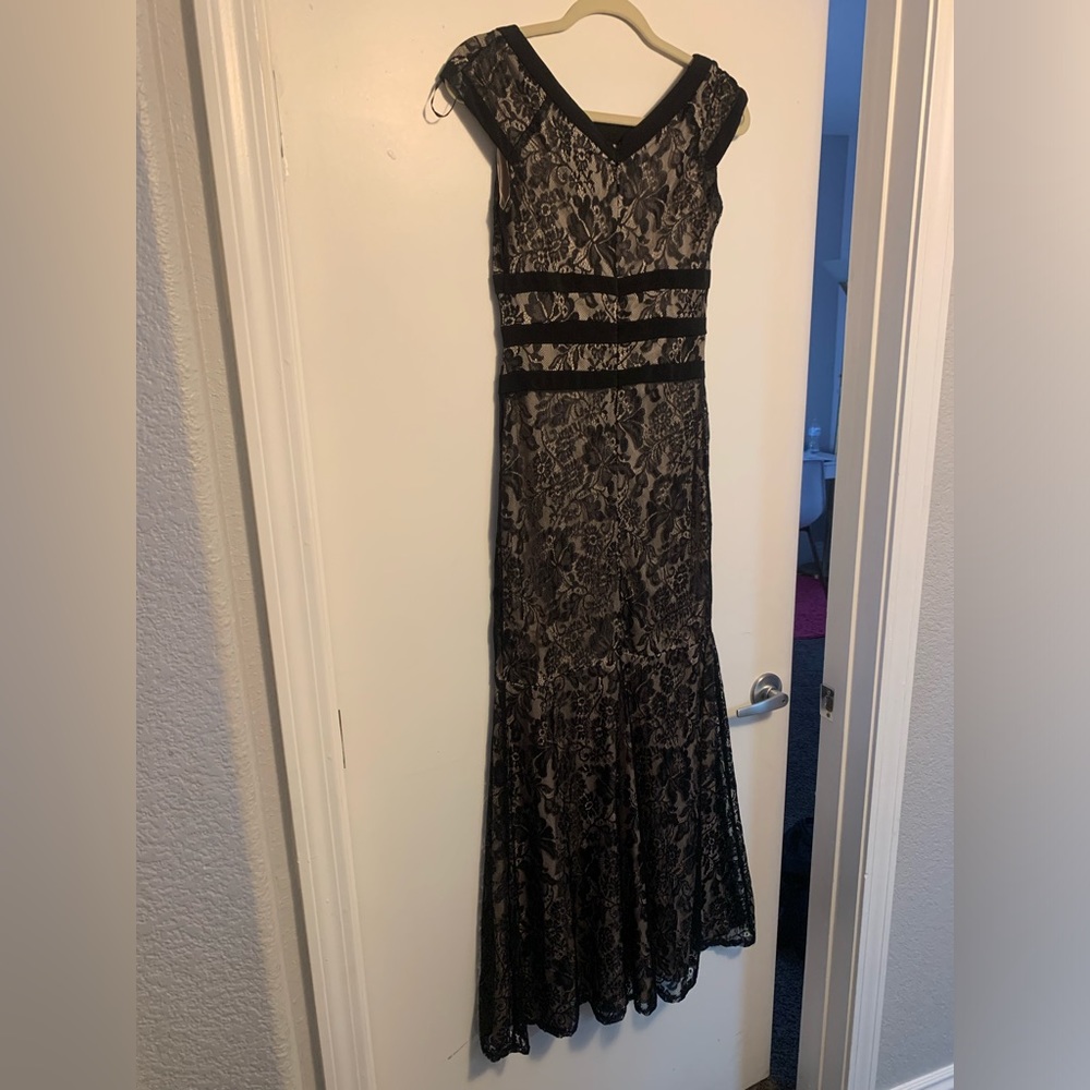 Women dress. Black with beige underneath. Used once.